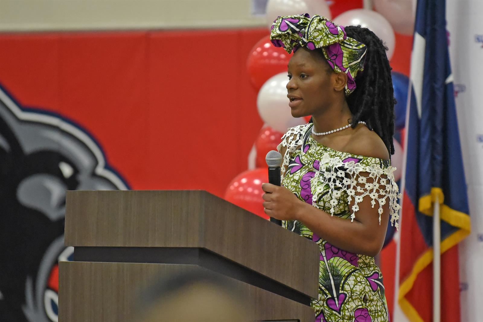 Cypress Springs High School sophomore Lumiere Kahongo reads a poem.
